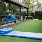 Inflatable gymnastic mat and teaching method