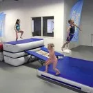 Creative play on gymnastics air floor